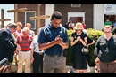 Robert Griggs (center) prays with others outside Morris Brown African Methodist Episcopal Church in Charleston, S.C. United Methodists joined AME members in prayers following the deadly shooting at Emanuel AME Church in Charleston. 