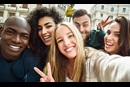 Group of young people taking a selfie.