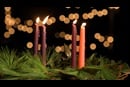 An Advent wreath with four lit candles represents the fourth week of Advent.  Photo by Kathleen Barry, United Methodist Communications.