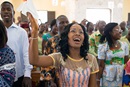 Claudia Teli N'guessan sings during worship at Temple Emmanuel United Methodist Church in Man, Côte d'Ivoire, in this 2015 file photo. Photo by Mike DuBose, UM News.