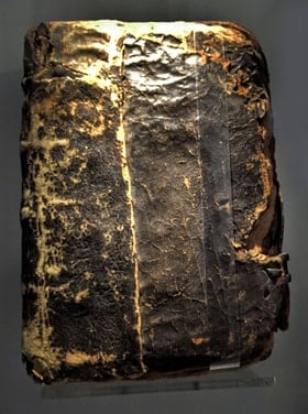 A charred Bible found under rubble on the grounds of the rectory at Epworth may have belonged to the Wesleys and survived the fire. Photo by Joe Iovino, United Methodist Communications.