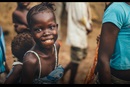 Child smiling to the camera UMCOR