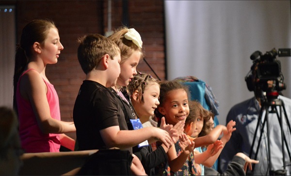 Children leading a song in worship. Staff photo. United Methodist Communications.