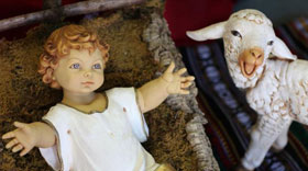 Baby Jesus and lamb figurine from Nativity scene. Photo by Kathleen Barry, United Methodist Communications.