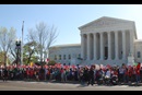 Demonstrators stand outside the U.S. Supreme Court on April 18 as the court hears oral arguments regarding the legality of two Obama Administration policies that would defer deportation for about 5 million immigrants. Photo by Walker Weatherly, Board of Church and Society