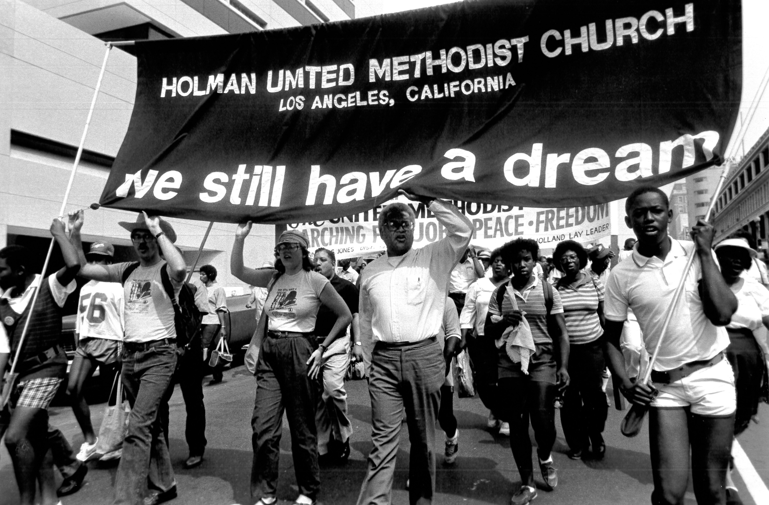 March for Peace, Jobs and Freedom on the 20th anniversary of the original march in Washington, D.C. 1984. The Rev. James Lawson (center) leads a group from Holman United Methodist Church in Los Angeles. Photo by John C. Goodwin, United Methodist Board of Global Ministries. March for Peace, Jobs and Freedom on the 20th anniversary of the original march in Washington, D.C. 1984. The Rev. James Lawson (center) leads a group from Holman United Methodist Church in Los Angeles. Photo by John C. Goodwin, United Methodist Board of Global Ministries.