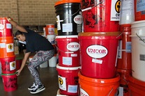 Flood buckets from UMCOR help after storms. File image by Mike DuBose.
