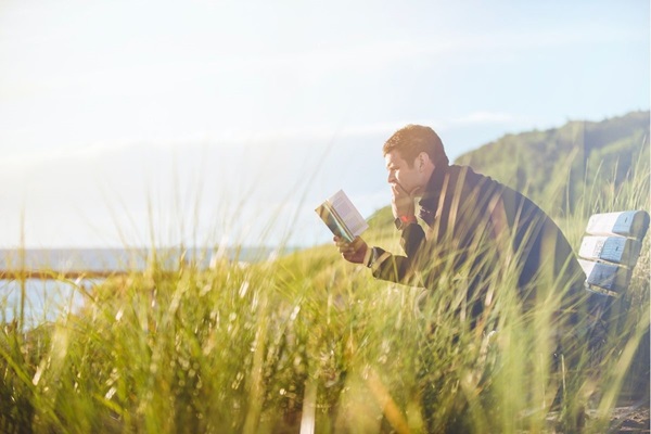 The Lenten season is a good time for United Methodists to reflect on what it means to be a follower of Christ.  Pick up a book, open the pages and take time to grow closer to God. Photo by Ben White for Unsplash.