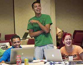 Freddie Bermudez (left), Francisco Nolla (center) and Angélica M. Rivera-Morales share a laugh during the 2012 MARCHA meeting in Lake Junaluska, N.C. Photo by Mike DuBose, UMNS.