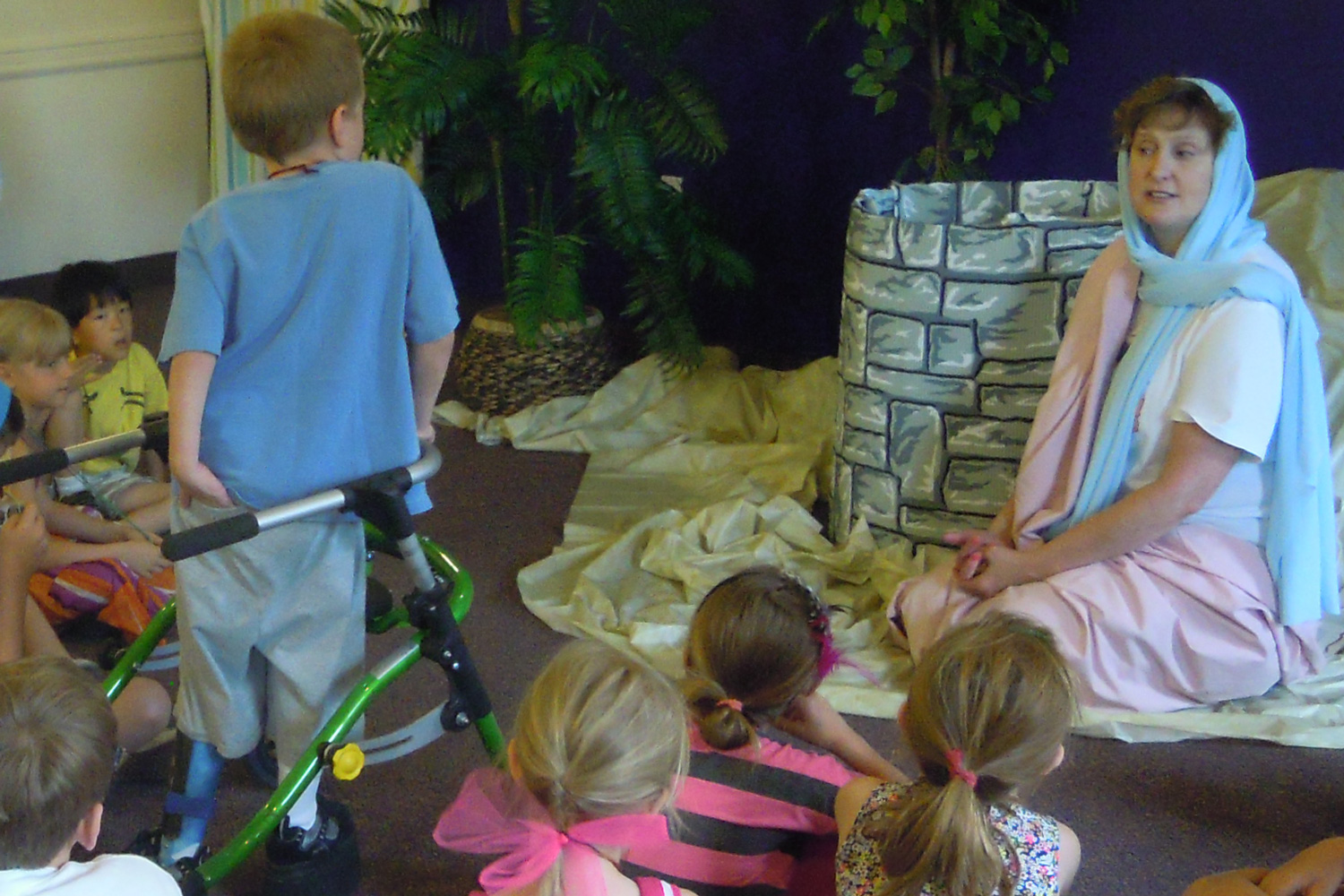 Rev. Jean Schwien plays the woman at the well at VBS.