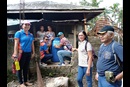 United Methodist pastors and disaster management team leaders evaluate a rainwater-harvesting tank that was installed a month earlier in the Novele community in the Davao Area of the Philippines. The United Methodist Church distributed the drums to more than 30 households and three community centers in the region. Pictured (from left to right) are the Rev. Marlyn N. Nabatilan, an unnamed neighbor, recipient Janeth Erandio, the Rev. Jerson Sanggo and team leaders Eddie Danglapen, Fe Tomas and Maurice Bigaran. Photo courtesy of the Rev. Dan Reuben L. Sison.