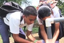 Children get water from a pump in video about global health efforts of The United Methodist Church. Video image courtesy of Board of Global Ministries.