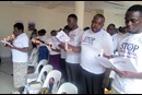Participants at a United Methodist workshop on domestic violence hold a candlelight vigil in memory of victims and survivors. Photo by Eveline Chikwanah