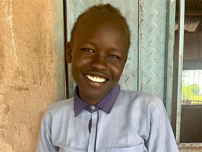 Abu, a 5th grader at St. Paul School in Aweil, South Sudan, says she wants to be a pilot when she grows up. Abu was one of the students who came out to meet the team that fixed the well the school uses. (Photo: WIB)