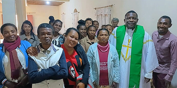 The Rev. Éric Kalumba (second from right) poses with church leaders at Ambodifasika United Methodist Church in Ambodifasika, Madagascar. After arriving last year, Kalumba went to work, convening the church council to listen to their concerns and develop strategies to expand The United Methodist Church in Madagascar. Photo by Esdras Rakotoarivony, UM News.