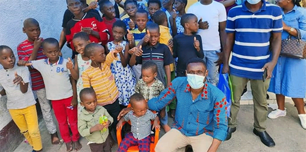 Innocent Afful, a missionary with the United Methodist Board of Global Ministries, poses with children from a church-supported orphanage in Kinshasa, Congo. Funding from a Global Ministries Advance project teaches orphans vocational skills. Photo courtesy of Innocent Afful.