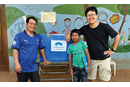 One of the ministries of the Methodist Church in Cambodia is sharing children’s clothes with Mondulkiri Methodist Church. Missionary Andrew Lee is pictured in the far right. (Photo: Courtesy of Janice Lee)