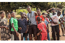 (Center) Mike Ayensu-Mensahis with some school children from school. Courtesy Photo.
