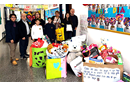 Missionary Luis de Souza Cardoso (second from left) and a group of students and teachers from Crandon Salto school displaying toys collected for a giving project for children in a nearby neighborhood. (Photo: Courtesy of Crandon Salto school)