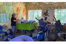 Leah Swineford works with children at the Nyadire Mission Center's Hearing Innovation. Courtesy photo.