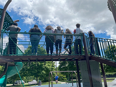 The Open Arms youth group feigning camera shyness on an outing this summer. Photo: Julie Wilson