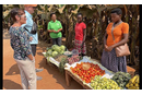 Rev. John Legg and his wife, Latrice, visit a market made possible by Zoe Empowers in a remote Rwanda village.