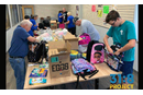 Members of McCabe UMC fill Bravery Backpacks for the 31:8 Project.