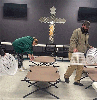 Volunteers at Fountain City's warming center prepare for guests.