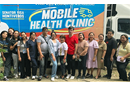 Members of the medical mission team pose in front the Mobile Health Clinic where X-rays and ultrasounds were done during a free health care outreach event at Spottswood Methodist Center in Kidapawan, Philippines, June 21-22. Photo courtesy of Davao Episcopal Area Communications.
