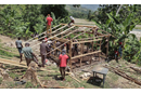 Volunteers of Jeremie Rising frame a shelter for a family home. This joint venture project with Next Generation costs about $3,000 and takes a week to build. The goal is to erect 20 such structures every year. ~ photo courtesy Jeremie Rising