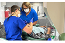 Dr. Jason Holland and dental assistant, Sarah Donaldson, work on a patient in the mobile dental clinic. Courtesy photo.