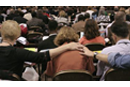 General Conference delegates pray over their decision making. 