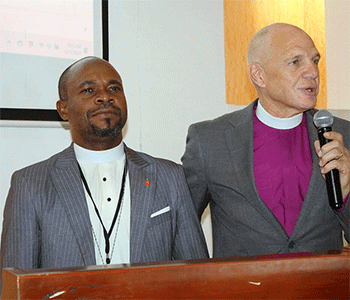 Bishop John Schol (right), who has been serving as the lead bishop of the Nigeria Episcopal Area since August, speaks after the Rev. Ande Ikimun Emmanuel is elected bishop on the first ballot during The United Methodist Church’s West Africa Central Conference meeting at the Best Western Premier Hotel in Accra, Ghana, on Dec. 7. Photo by Eveline Chikwanah, UM News.