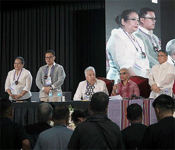 Bishop Tracy S. Malone, president of the United Methodist Council of Bishops, addresses the Philippines Central Conference following the reelection of the region’s three bishops. The reelected bishops, standing from left, are Ruby-Nell M. Estrella, Israel M. Painit and Rodel M. Acdal. Seated with Malone is Bishop Ruben Saenz Jr., president-elect of the council. Photo by Gladys P. Mangiduyos, UM News