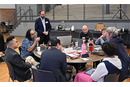David Scott (standing), senior director of mission theology and strategic planning for the United Methodist Board of Global Ministries, listens to members of the Connectional Table discuss colonialism Oct. 24 during orientation training in Dallas. Photo by Jim Patterson, UM News.