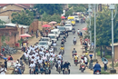 A caravan using loudspeakers to broadcast a call for peaceful elections makes its way through Kibombo, Congo. Photo by Chadrack Tambwe Londe, UM News.