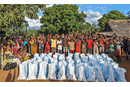 Community members from Andranokaky, Madagascar, celebrate the food and other supplies distributed by The United Methodist Church in Madagascar. Extended drought and flooding has created food insecurity in the region. Photo by Justin Rakotoarimanana.