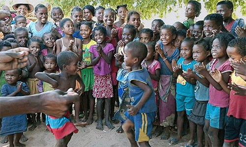 Children perform a traditional dance as a sign of gratitude to volunteers from The United Methodist Church who brought them food in Andranokaky, Madagascar. Members of Ambodifasika United Methodist Church, the first United Methodist church on the island nation, traveled more than 500 miles to deliver the aid. Photo by Justin Rakotoarimanana.