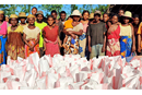Survivors of Cyclone Freddy in Andranomavo, Madagascar, receive food aid from the UMC in Madagascar with a grant from UMCOR. (Photo: Justin Rakotoarimanana)