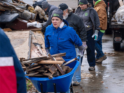 Katie Hills, UMCOR's director of Disaster Response, assesses the situation in Boone, NC, while pitching in with ERTs to clear debris from Valle Crucis UMC. (Photo: Ben Rogers, WNCC).