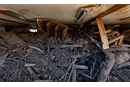 Debris caused by Hurricane Helene’s floodwaters fills the fellowship hall to within inches of the ceiling at Pensacola United Methodist Church in Burnsville, N.C. (Photo: Mike DuBose, UM News)