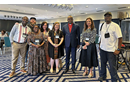 From left, Pacome Nguessan, Matt Crum, Priscilla Muzerengwa, Jennifer Rodia, Ashley Gish, North Katanga Area Bishop Mande Muyombo, Poonam Patodia and Chilima Karima celebrate together at the end of training on regionalization. All but the bishop work for United Methodist Communications. Photo courtesy of United Methodist Communications.